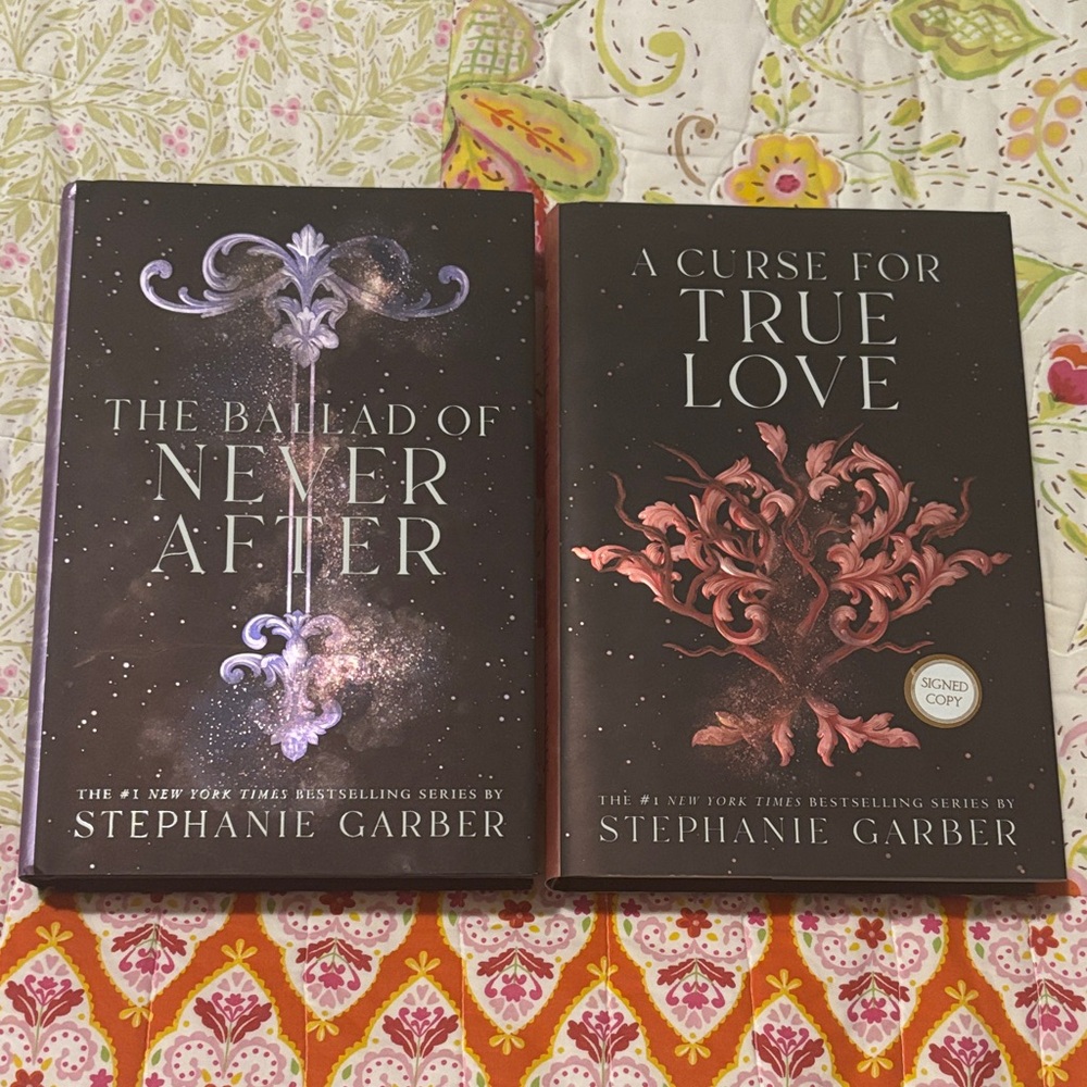 Both signed- The Ballad of Never After and A Curse for True Love